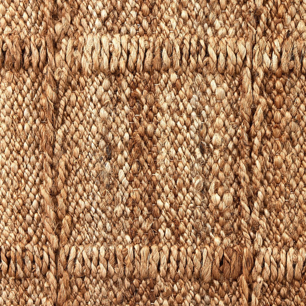 Grid Natural Jute Rug styled with grey sofa- pattern and texture