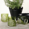 3 fern glasses styled with black pot and herbs
