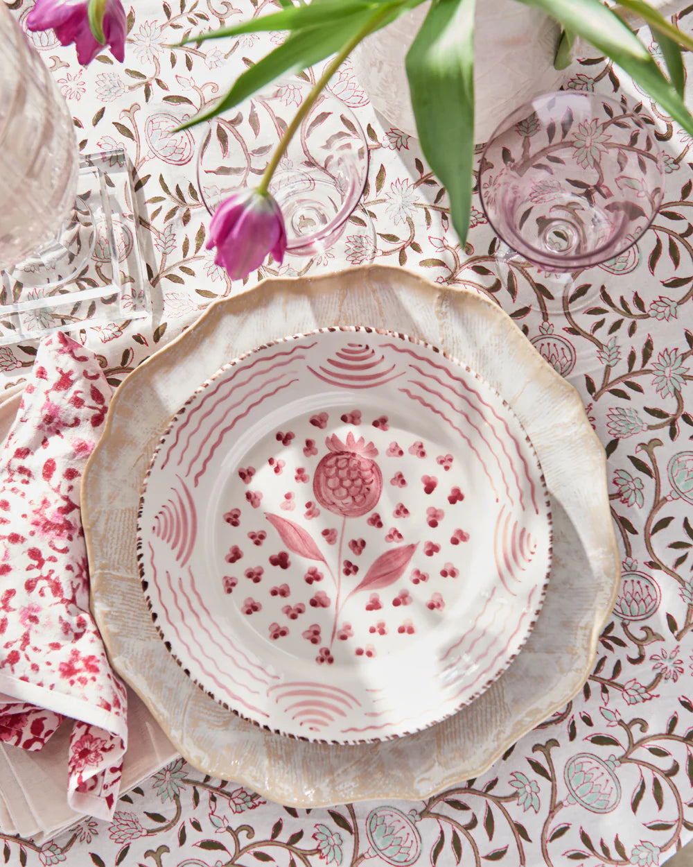 Casa Nuno Pink Pomegranate Plate styled with tulips