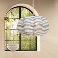 Blue Stripe Beaded Clamshell Chandelier in front of window