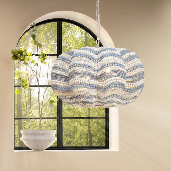 Blue Stripe Beaded Clamshell Chandelier in front of window