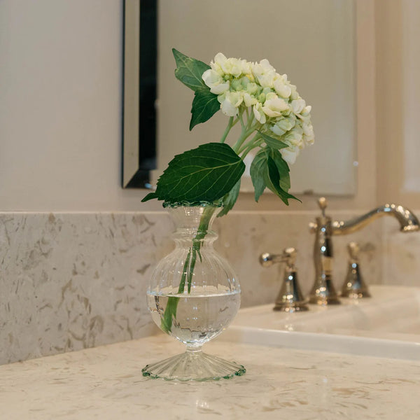 Aimee Green Trim Bud Vase in bathroom