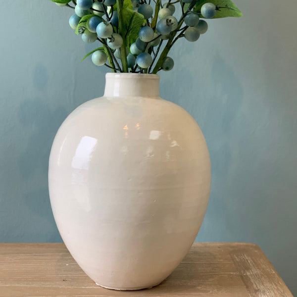 Neema Egg Shaped Pot with faux blooms