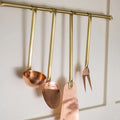 Copper and brass Utensils on Brass Rod
