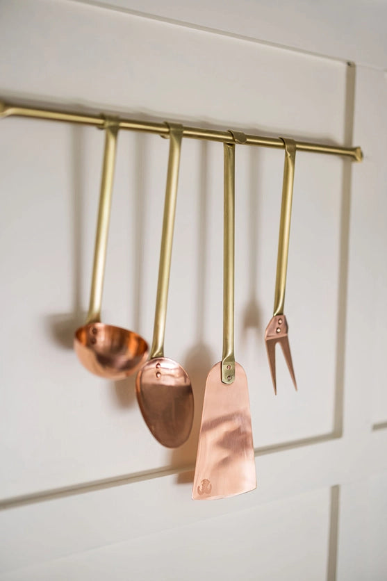 Copper and brass Utensils on Brass Rod