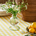 Aimee Green Trim Bud Vase on yellow gingham tablecloth