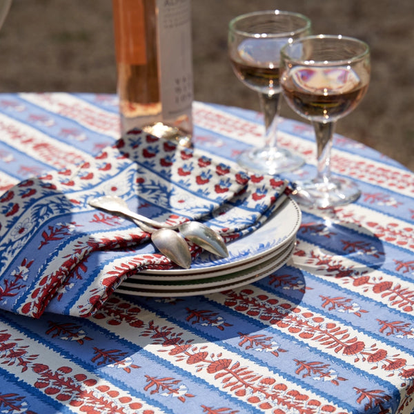 Avignon Napkins styled on table with wine glasses