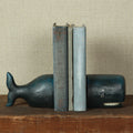 Blue Whale Cast Iron Bookends styled with vintage books on wood table