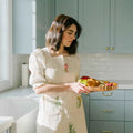 Botanical Embroidered Apron in blue kitchen