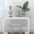 White console table with decorative items against a white wall - Brown Foo Dog Motif Table Lamp