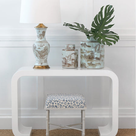 White console table with decorative items against a white wall - Brown Foo Dog Motif Table Lamp