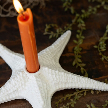 White Resin Starfish Candle Holder with lit candle