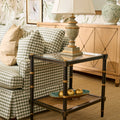 Cabana Cane Side Table styled in living room with check sofa