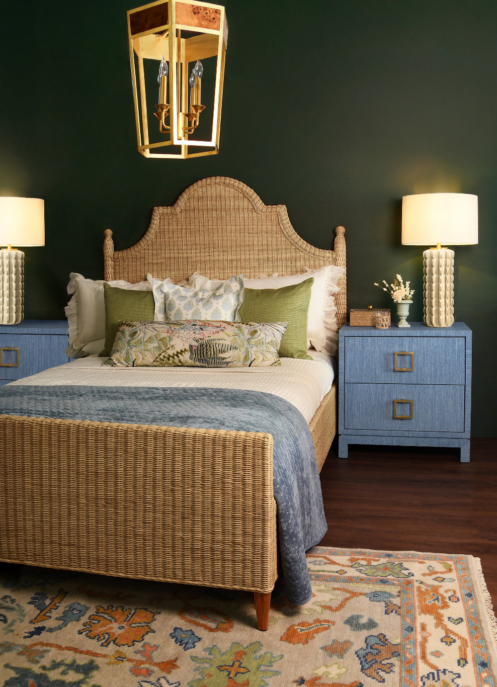 Calloway Woven Rattan Bed Styed in bedroom with blue grasscloth nightstands