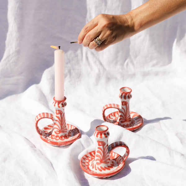 Casa Coral Candlesticks with lit candle