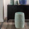 Carved Bamboo Celadon Garden Stool styled in front of cabinet