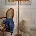 Carved Bamboo Cream Garden Stool styled with chair and floor lamp