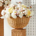 Charleston Woven Rattan Footed Bowl - styled with faux flowers