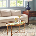 Cheshire Gold Bamboo Cocktail Table styled in blue room