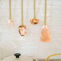 Copper Utensils on Brass Rod hanging above stove