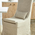 Beige chair with a pillow in a kitchen setting
