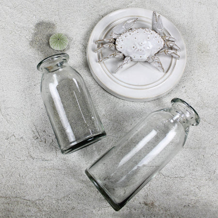 Crab Ceramic Wall Hanging styled with glass bottles