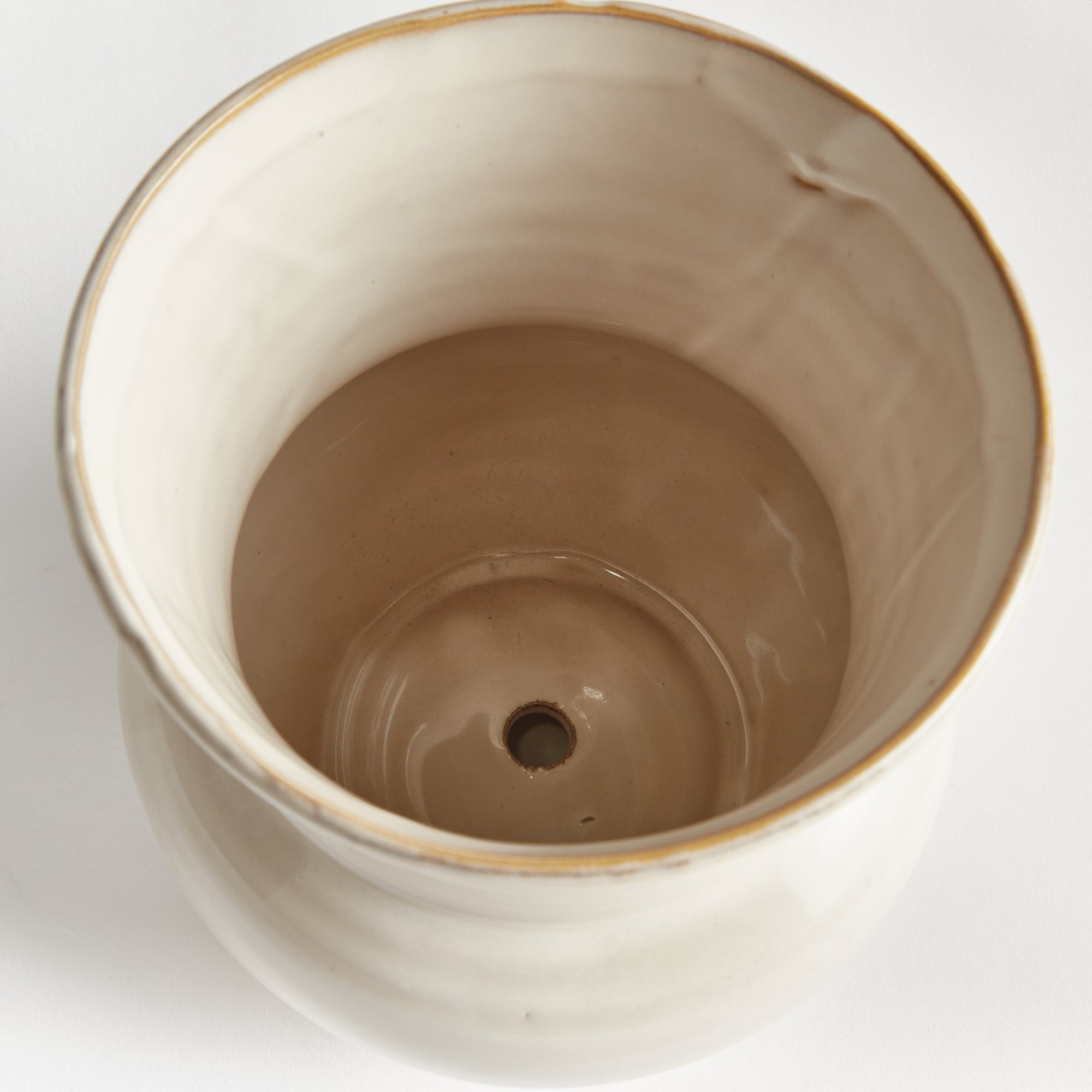 Dabney Ivory Stoneware Pot - drainage hole