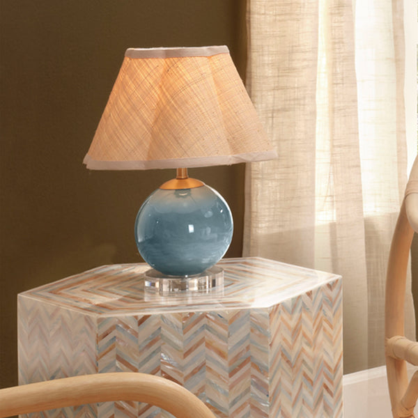 Dottie Aqua Mini Lamp with scalloped raffia shade on side table