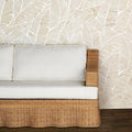 Duchess Woven Rattan Sofa with palm wallpaper background