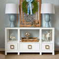 Edmond White Console styled with blue lamps