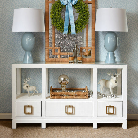 Edmond White Console styled with blue lamps