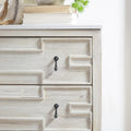 Evanne Entry Cabinet corner closeup with green plant