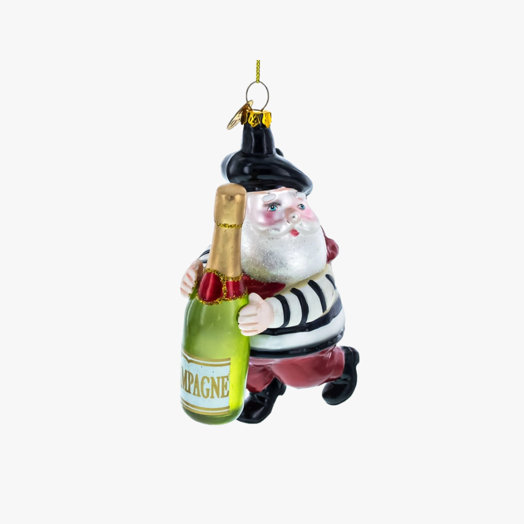 Decorative ornament of a Santa Claus holding a bottle labeled 'Champagne' on a white background