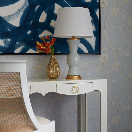 Gracie White Lacquer Desk styled with blue modern art