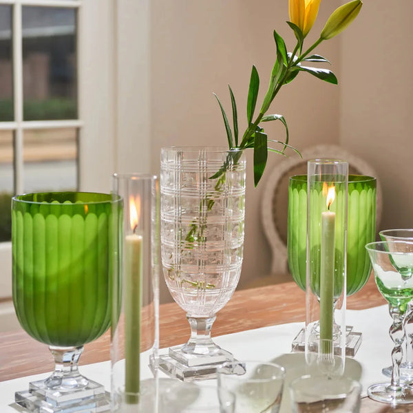 Green Glass Hurricanes styled on table