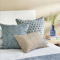Hera Azure Pillow Cover styled on bed