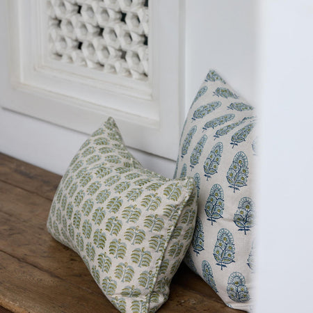 Hera Moss Celadon Lumbar Pillow Cover on wood bench