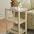 Isabella Cream Grasscloth Side Table next to sofa