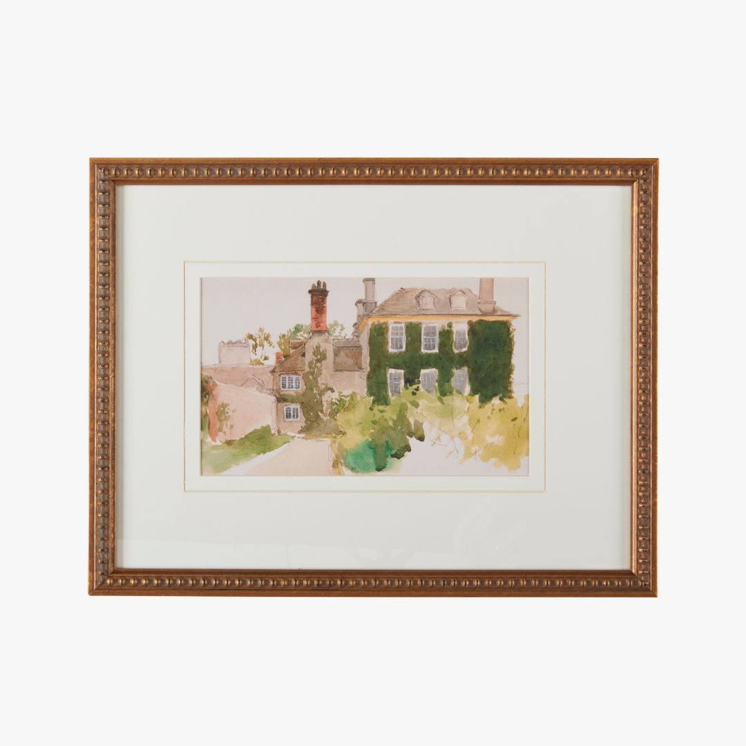 Framed watercolor painting of a house with greenery on a white background
