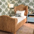 Jarrett Woven Water Hyacinth Bed styled in bedroom with wallpaper