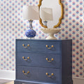 Kaia Gold Mirror above navy blue chest