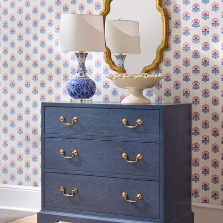 Kaia Gold Mirror above navy blue chest