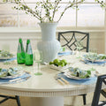 Keegan White Dining Table styled with blue placemats