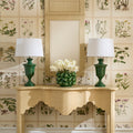 Kensington Raffia Console styled with Kilnbourne green lamps and botanical wallpaper