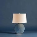 Kota Table Lamp styled on blue background