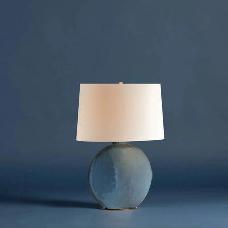 Kota Table Lamp styled on blue background