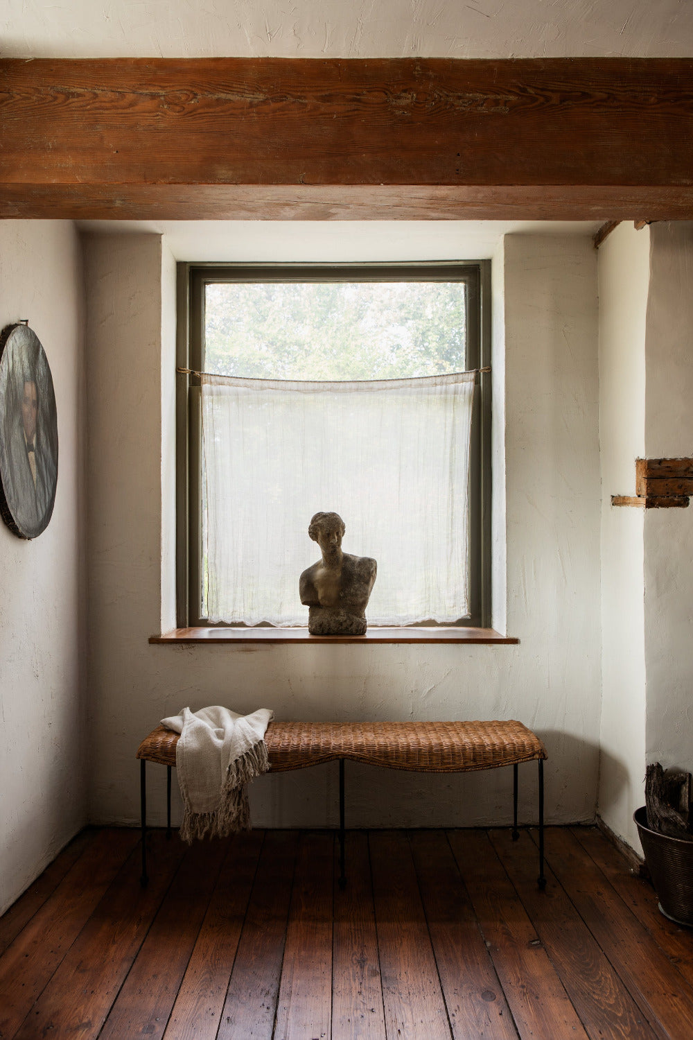 Lacoste Rattan Bench styled in front of window