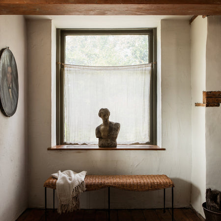 Lacoste Rattan Bench styled in front of window