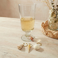 Las Brisas Shell Drink Charm styled on wine glass