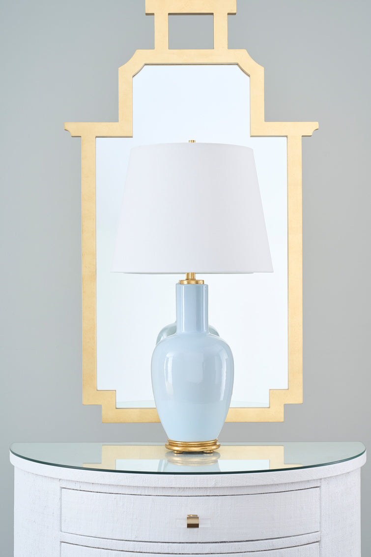 Leighton Sky Table Lamp in front of gold mirror